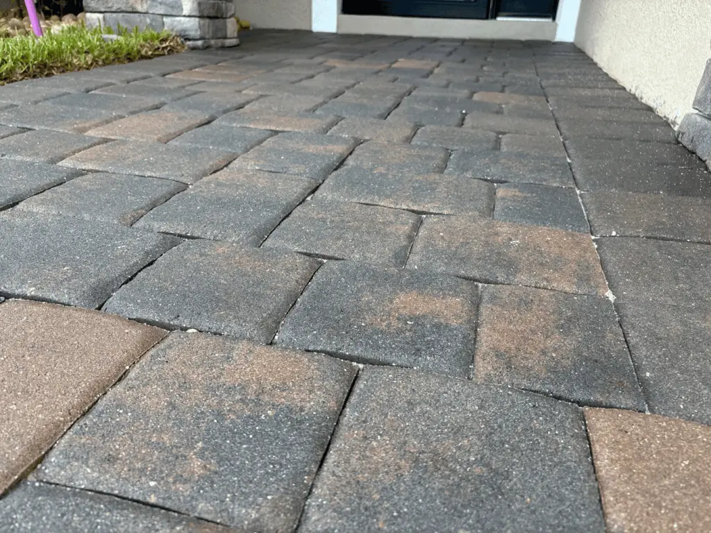 Charcoal and rust entry walkway pavers after cleaning and sealing
